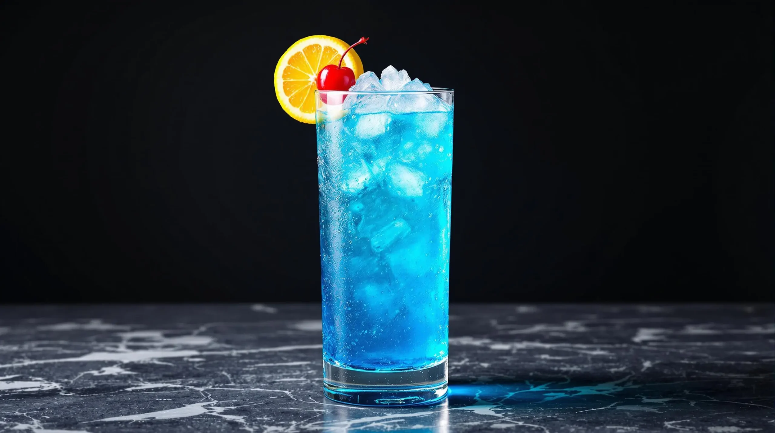 Electric blue Long Island Iced Tea cocktail in tall Collins glass with lemon wheel and cherry garnish against dark background